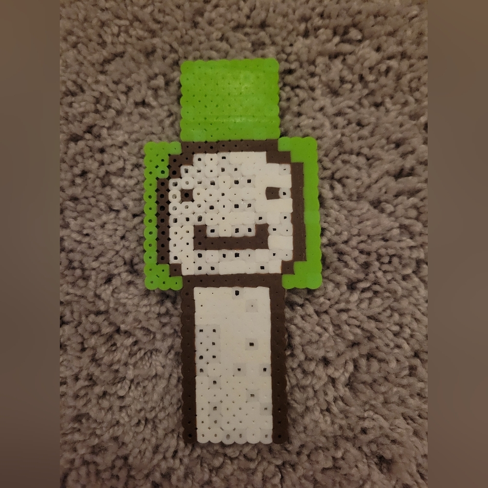Green and White Beaded Figure